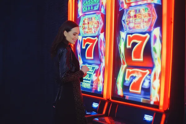 JILI7978 — A high-class gaming experience without limits A woman in a luxurious green gown next to an ornate roulette wheel, capturing the upscale casino mood of JILI7978.