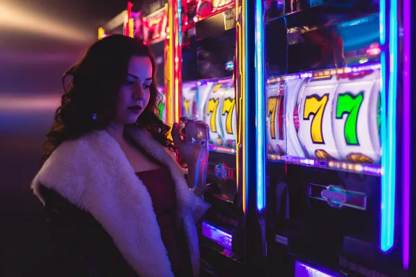 JILI7978 Mobile Casino — Play anytime, anywhere A player using their smartphone during a festive local event, representing JILI7978’s fully mobile-friendly casino.